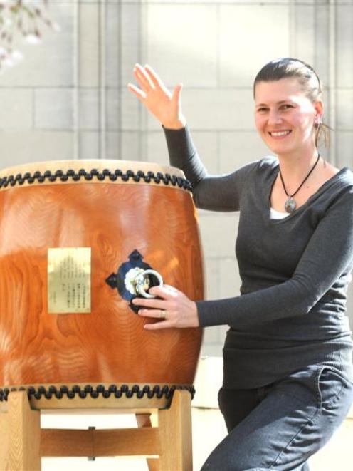 Dunedin-Otaru Sister Cities Society president Robyn Murray tries one of three taiko drums given...