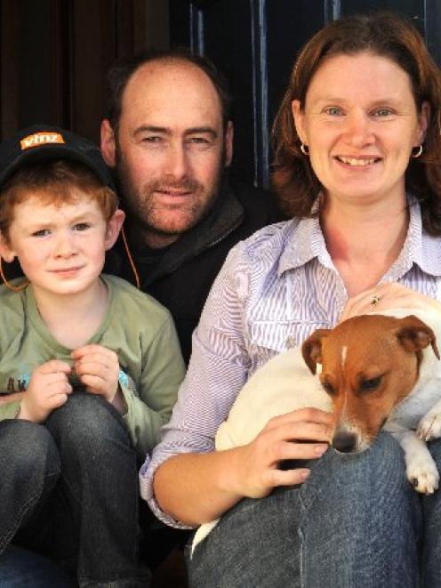 Dunedin parents Gary and Sharon Soal with son Linkin and the family dog Mazy in Dunedin yesterday...