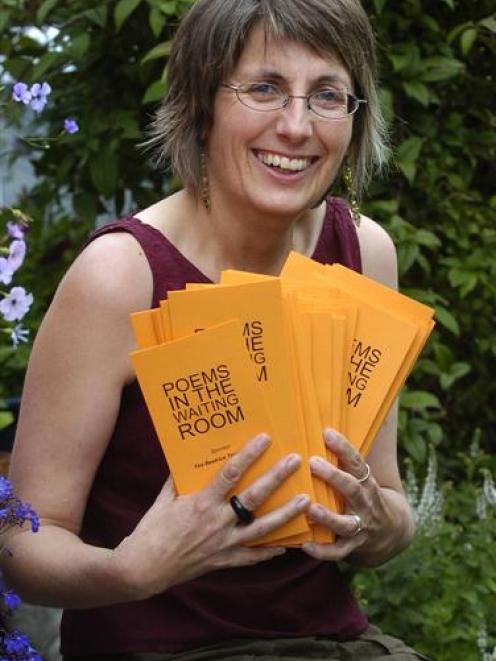 Dunedin poet Ruth Arnison with some of the poetry cards she is preparing to deliver to  waiting...