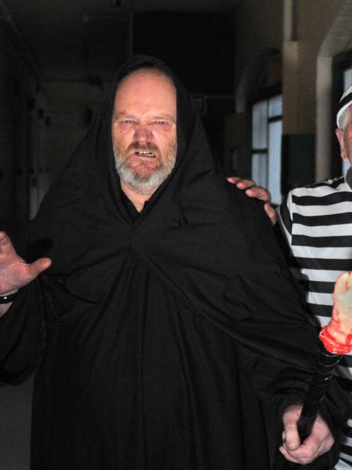 Dunedin Prison Charitable Trust volunteers Ken Burt (left) and John Thomson get into character...