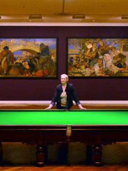 Dunedin Public Art Gallery collections  manager Robyn Notman stands beside a billiards table in...