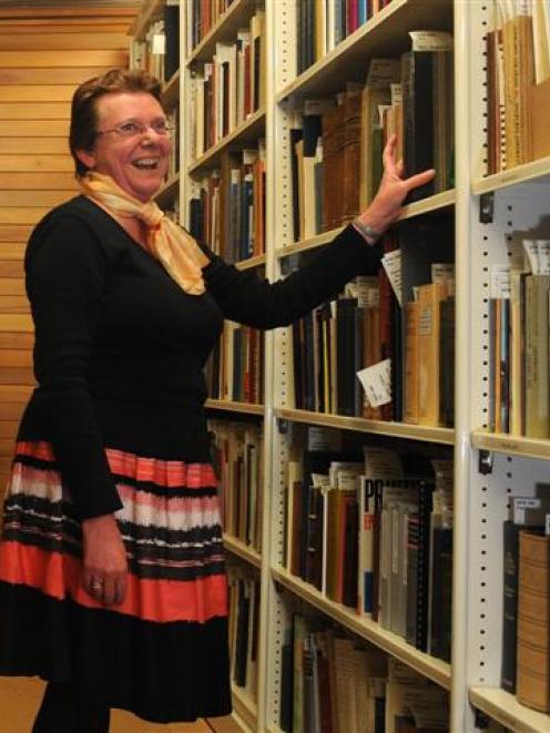 Dunedin Public Library heritage collection librarian Lorraine Johnston is pleased a condensation...