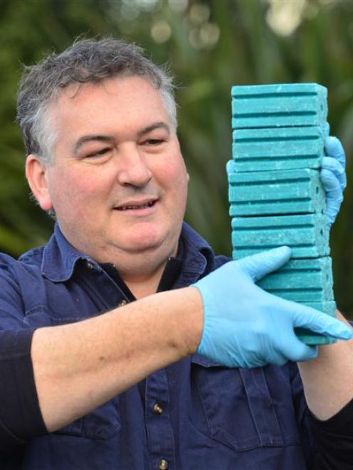 Dunedin rat exterminator Paul Corkin holds 1.5kg of rat poison in Waikouaiti. Photo by Peter...