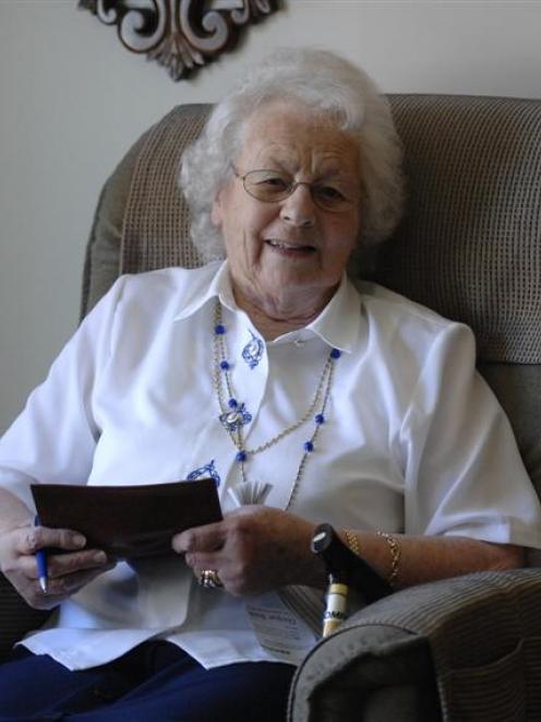 Dunedin resident Anne Montgomery keeps her Bank of New Zealand cheque book and pen handy, having...