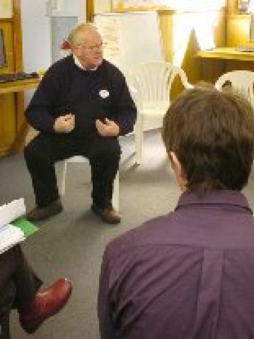 Dunedin resident Jan Clark (right) questions local body candidates (clockwise, from top) Cr...