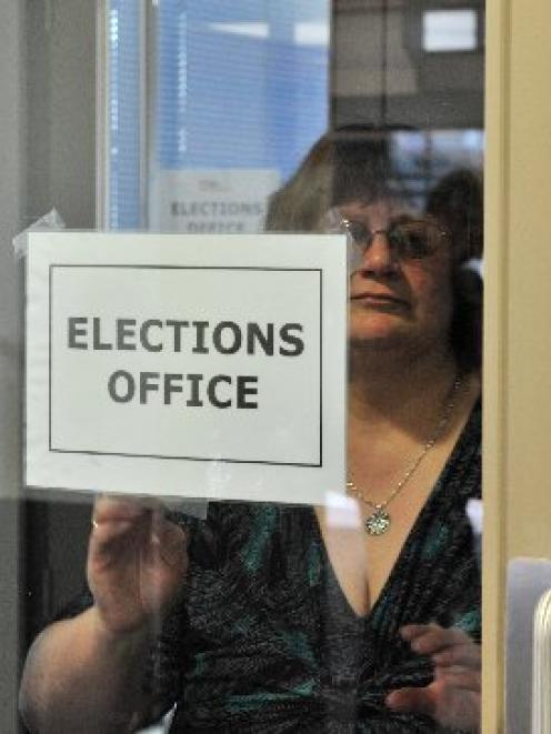 Dunedin returning officer Pam Jordan takes down the elections office sign  at the DCC at noon...
