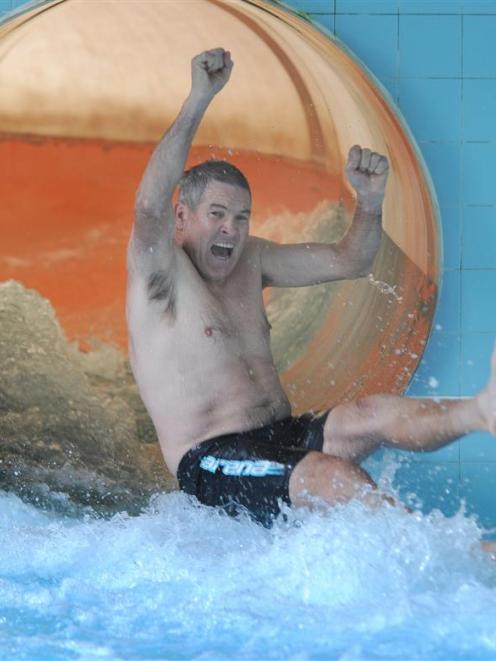 Dunedin's Moana Pool plant supervisor Kevin Brown (63) emerges triumphant from the waterslide...