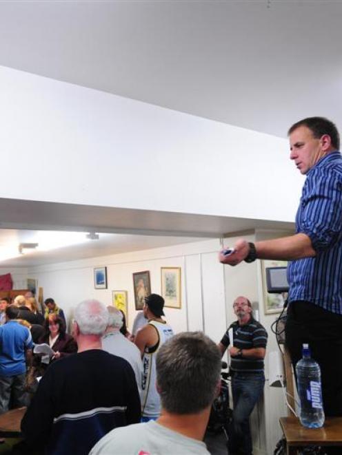 Dunedin Sale Rooms auctioneer Kerryn Woods works the crowd at the police auction yesterday...