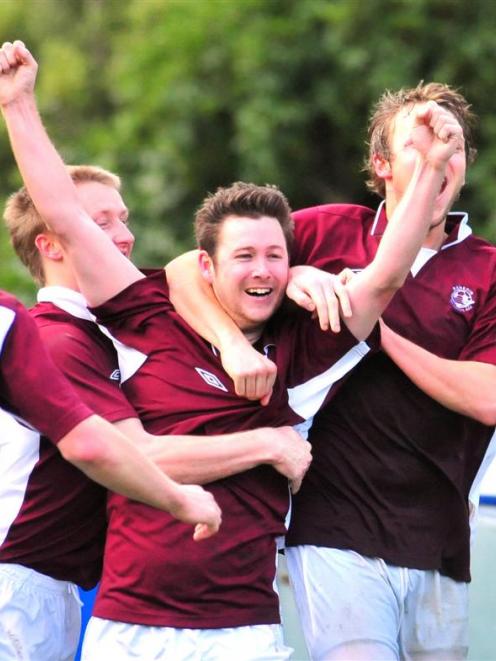Dunedin Technical players (from left) Ross McKenzie, Aaron Burgess and John Chisholm celebrate...