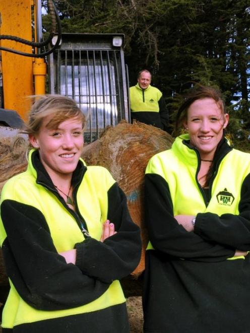 Dunedin twins Melissa (left) and Danielle Wallace (18) both occasionally operate excavators....