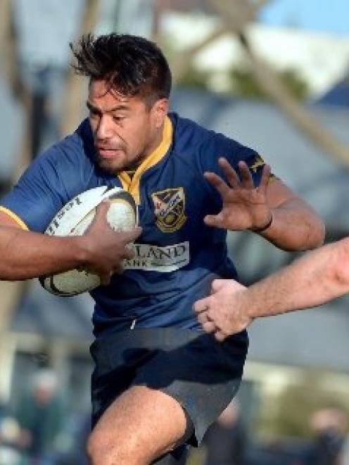 Dunedin utility back Trent Renata is stopped in his tracks by Alhambra-Union halfback Caleb Gray...