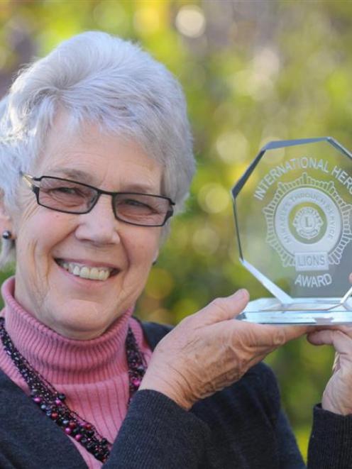 Dunedin woman Genny Hanning shows off the Lions Club International award she accepted in front of...