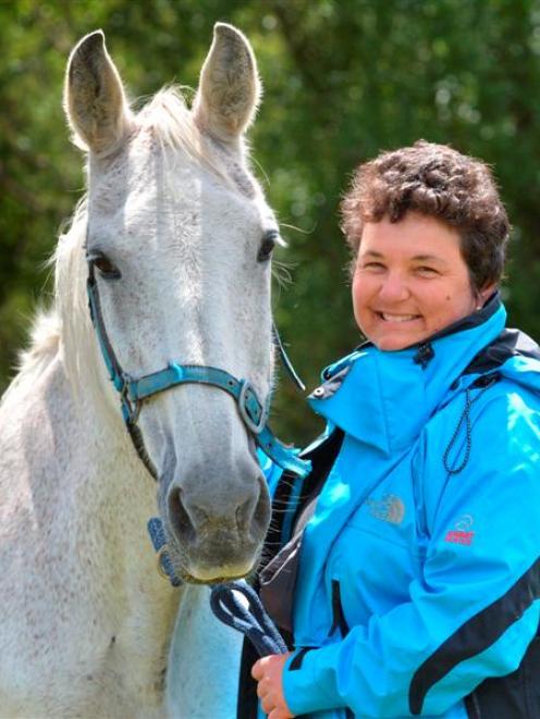 Dunedin woman Ulli Graham and horse Lucy, in Abbotsford yesterday, took a tumble on Abbots Hill...
