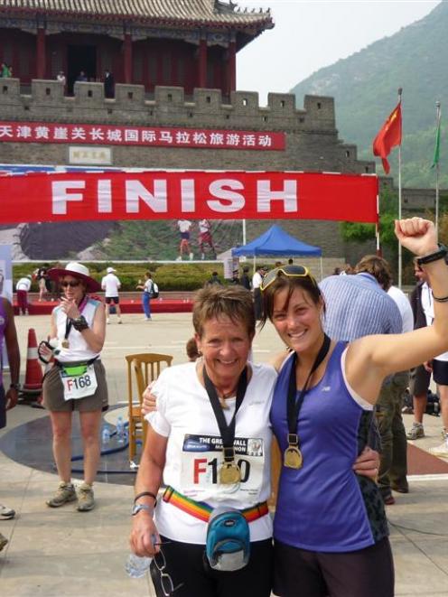 Dunedin women Dot Mowat and Kate Morland celebrate after completing the Great Wall Marathon, in...