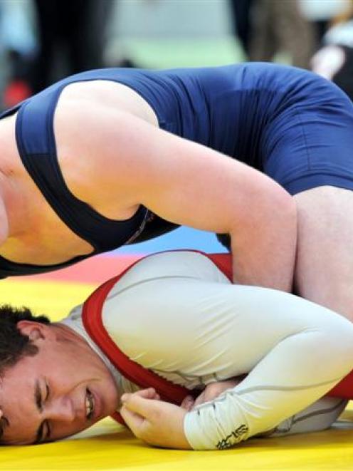 Dunedin wrestler Shem Murdoch (top) is in command of his bout against Ben Ferris, also of Dunedin...