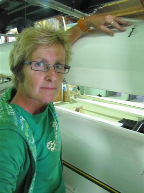 Dunstan Arm Rowing Club president Jacqui van Dam examines one of the holes made in eight of the...