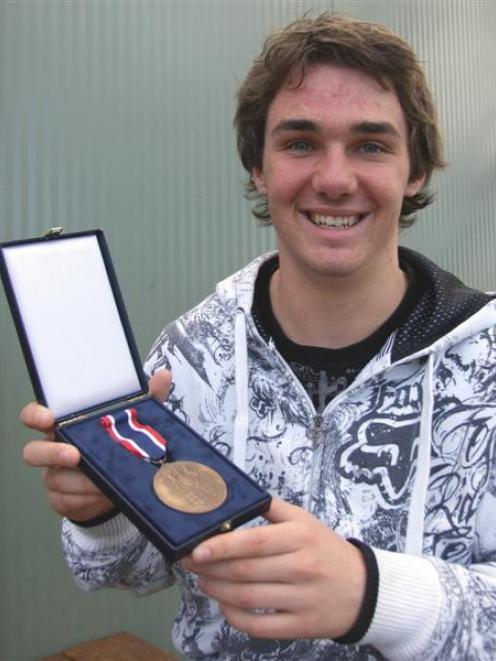Dunstan High School pupil Jared Lewis with the bronze medal he won at the International Chemistry...
