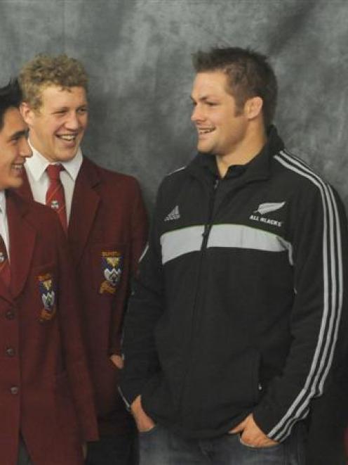 Dunstan High School pupils have their photograph taken with All Black captain Richie McCaw at the...