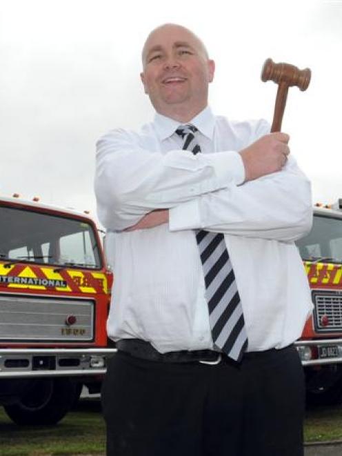 Dwayne Johnston is keen to drop the hammer on three fire engines,  for sale at Turners Auctions...