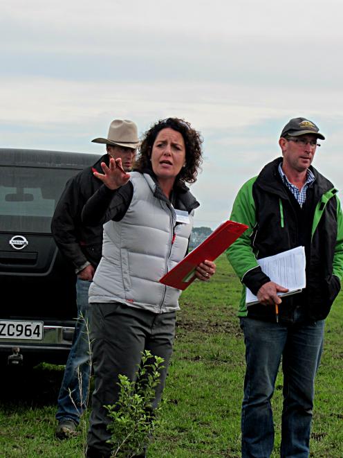 Ealing dairy farmer Devon Slee talks about native plantings on the property. At right is Andrew...