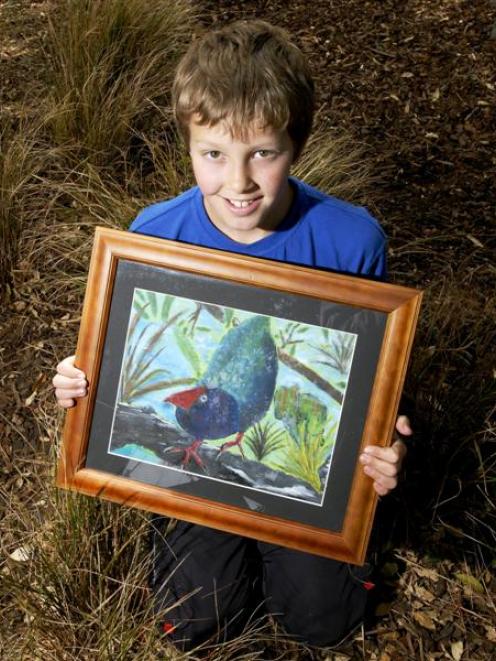 East Taieri School pupil Bailey Clouston with his artwork, Inquisitive Takahe, which won the...