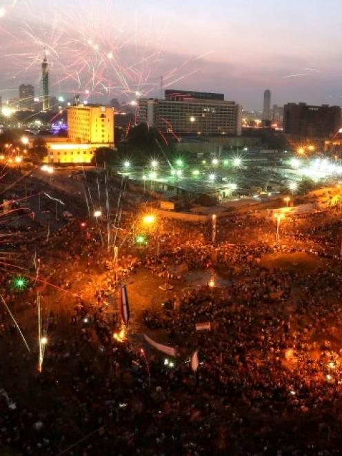 Egyptians celebrate after the swearing-in ceremony of President Abdel Fattah al-Sisi in Tahrir...