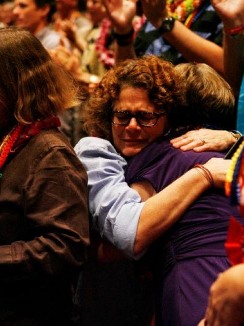 Eileen McKee (C) hugs Carolyn Golujuch during celebrations after same sex marriage was made legal...