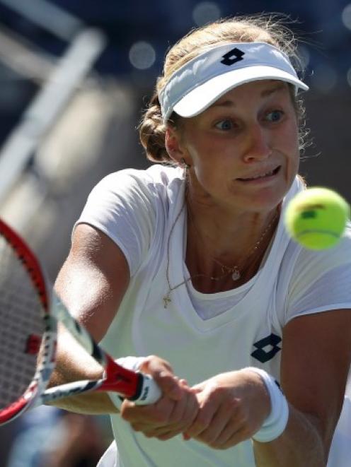 Ekaterina Makarova hits a return to Victoria Azarenka. REUTERS/Mike Segar