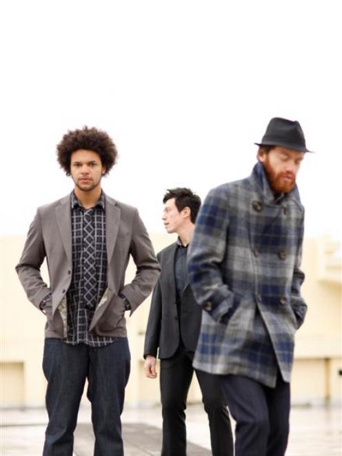 Electric Wire Hustle (from left) drummer Myele Manzanza, multi-instrumentalist and producer Dave...