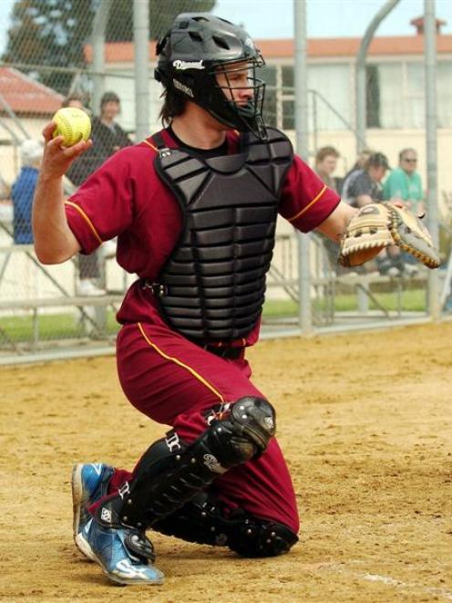 Ellis Park catcher Campbell Makea gets ready to return the ball to pitcher Claire Velaski in the...