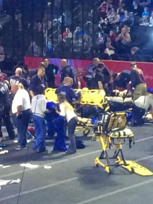 Emergency personnel attend to circus performers injured in the fall. REUTERS/Aletha Wood