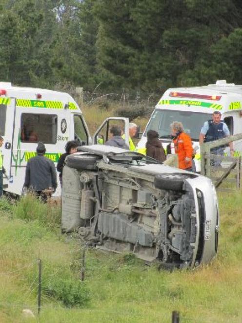 Emergency services attend Saturday's crash at Tarras. Photo by Sarah Marquet