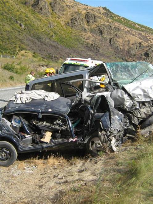 Emergency services tend to the victims of a head-on crash in the Lindis Pass yesterday. Photo...