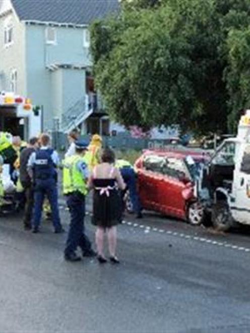 Emergency services work at the scene of a two-vehicle crash on upper Stuart St, Dunedin, on...