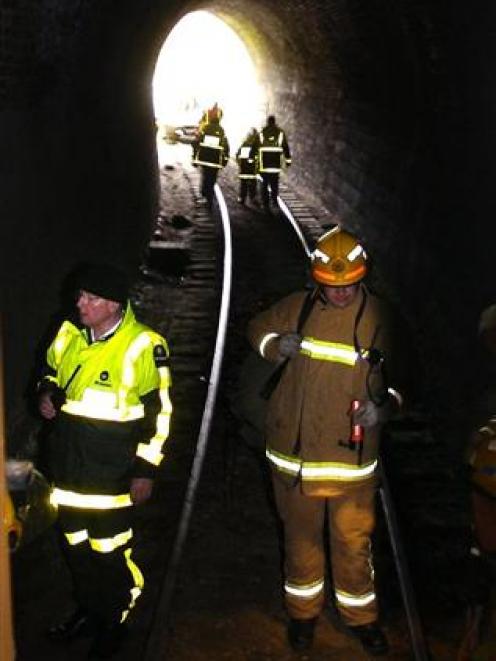 Emergency services workers at the completion of a multi-agency exercise in which a Taieri Gorge...