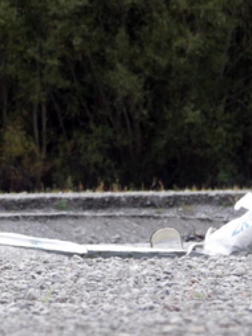 Emergency workers at the site of the air crash in the Ngaruroro River. A visitor from Britain and...