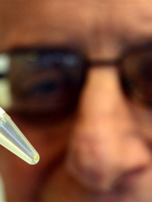 Emeritus Prof Rob Smith holds a small amount of a man-made compound which could reduce damage...