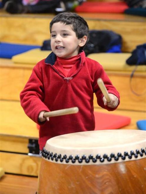 Emery Santana (4), of Dunedin, takes  part in a taiko drumming workshop at the College of...