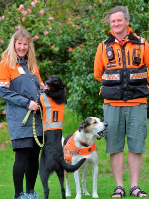 Emma Milburn with Dart, who is now Dunedin's fourth operational LandSAR dog, along with Fin and...