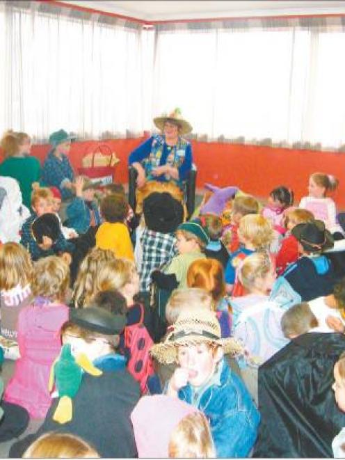 Story time: Arabella Storyteller (Valmai Redhead) prepares to read a story to the children in...
