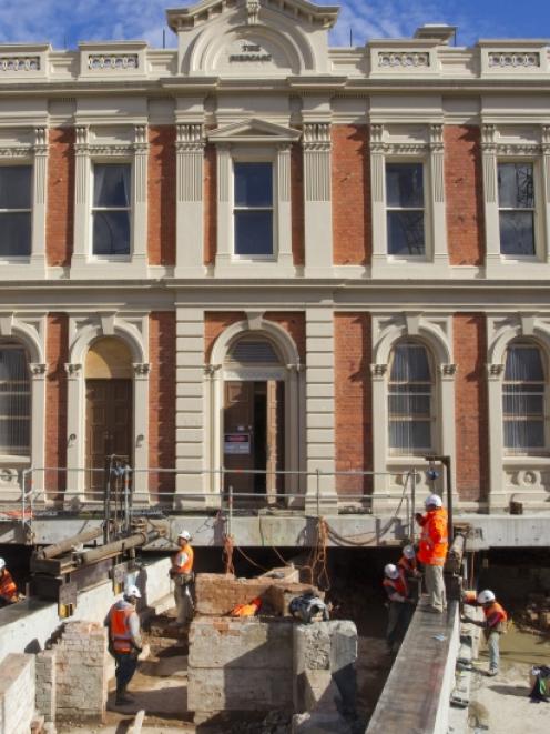 Engineers relocate the 124-year-old Rob Roy Hotel so construction work can take place on the...