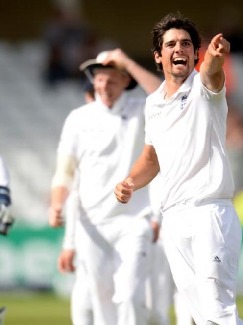 England captain Alastair Cook celebrates after dismissing India's Ishant Sharma. REUTERS/Philip...