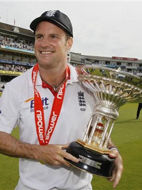 England captain Andrew Strauss holds the winners trophy after his team beat India in the fourth...