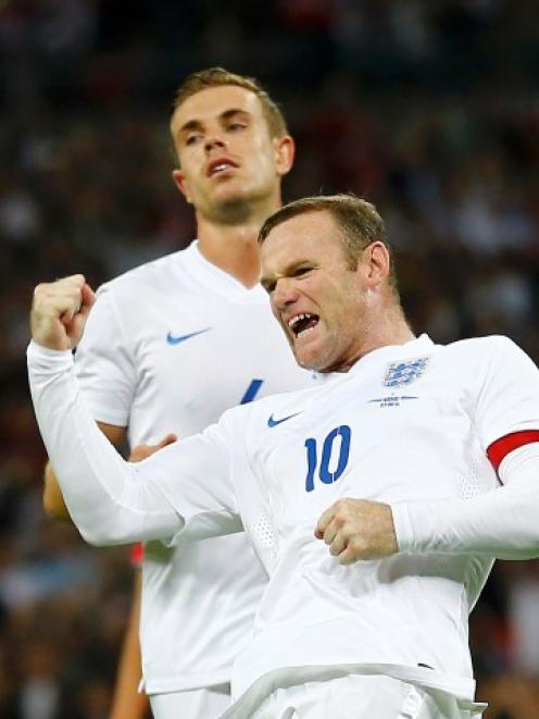 England captain Wayne Rooney celebrates after scoring his penalty against Norway. REUTERS/Darren...
