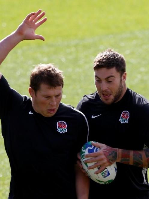 England hooker Dylan Hartley (L) and teammate Matt Banahan practise during a Rugby World Cup...