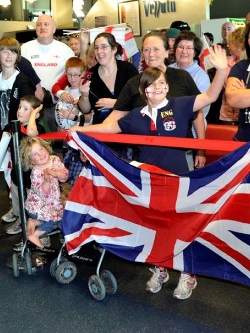 England rugby team supporters show their true colours while greeting their Rugby World Cup heroes...