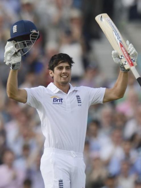 England's Alastair Cook celebrates after reaching his century during the first test against South...