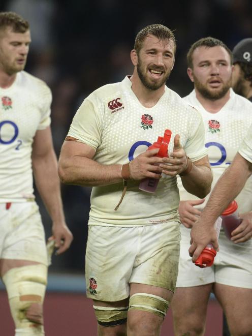 England's captain Chris Robshaw (3rd L) leads his team from the field after they lost their...