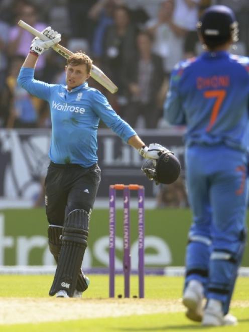 England's Joe Root celebrates reaching his century during the fifth one-day international cricket...