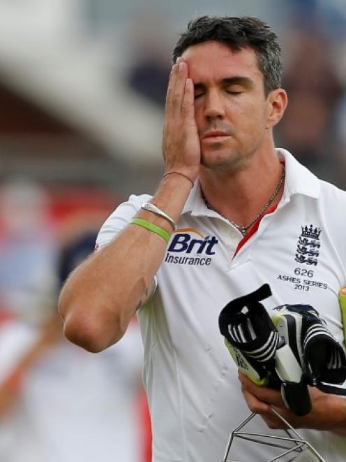 England's Kevin Pietersen walks off after being dismissed on the final day of the third Ashes...